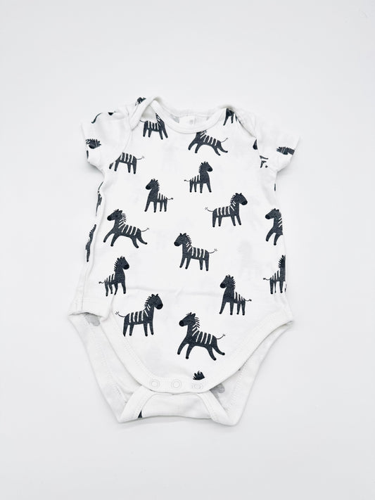Weißer Body mit Zebra-Print - Gr. 74 (C&A)